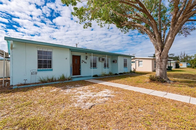 ranch-style house with a front lawn