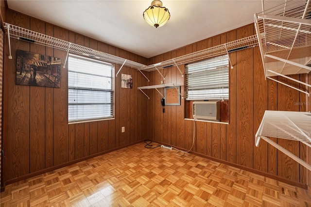 interior space with light parquet floors and cooling unit