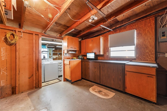 kitchen featuring a wealth of natural light and washer / dryer