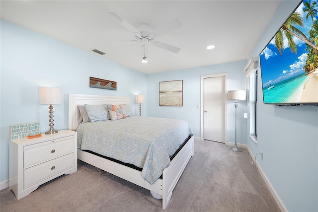 bedroom featuring ceiling fan and light carpet