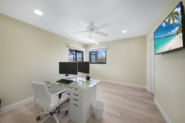 office with ceiling fan and light wood-type flooring