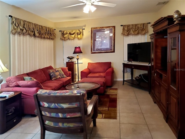 tiled living room with ceiling fan