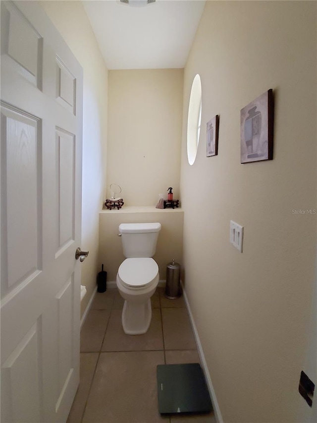 bathroom featuring tile patterned floors and toilet