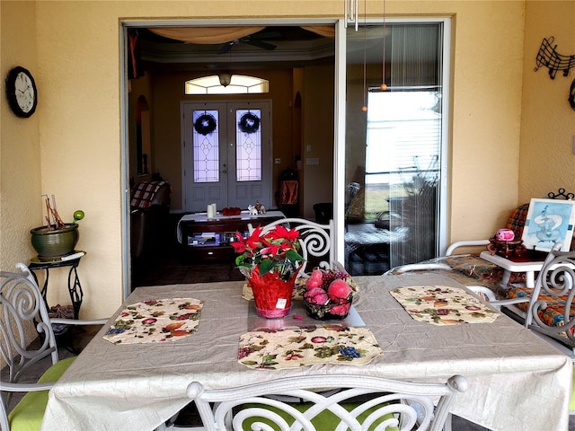 dining room with french doors and ornamental molding