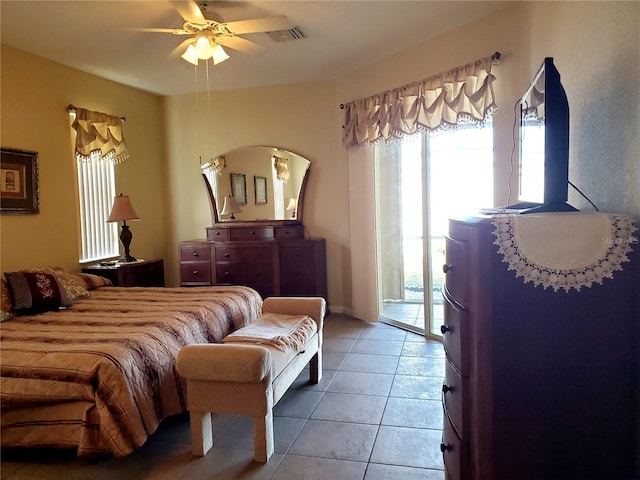 1057 Staley St, Port Charlotte, FL 33952 - bedroom featuring a ceiling fan, light tile patterned floors, access to exterior, and visible vents