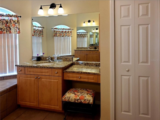 1057 Staley St, Port Charlotte, FL 33952 - bathroom featuring a closet, tile patterned flooring, and vanity