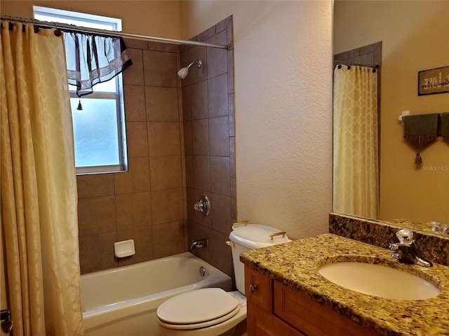 1057 Staley St, Port Charlotte, FL 33952 - full bathroom with a textured wall, toilet, vanity, and shower / bath combo