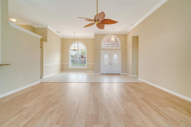 entryway with ceiling fan, ornamental molding, and light hardwood / wood-style floors