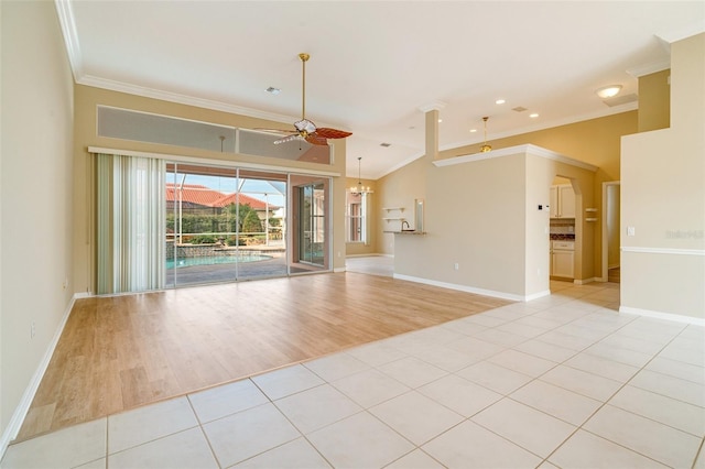 unfurnished living room with crown molding, ceiling fan, light tile patterned flooring, and vaulted ceiling