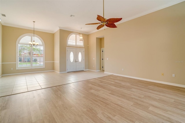 entrance foyer featuring crown molding, ceiling fan with notable chandelier, and light hardwood / wood-style flooring