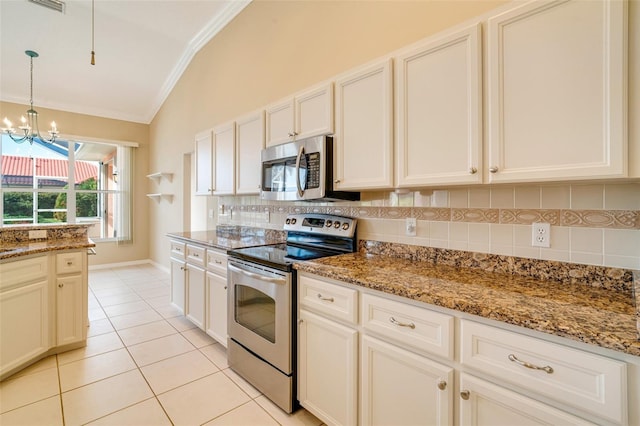 kitchen featuring lofted ceiling, light tile patterned floors, backsplash, stainless steel appliances, and light stone counters