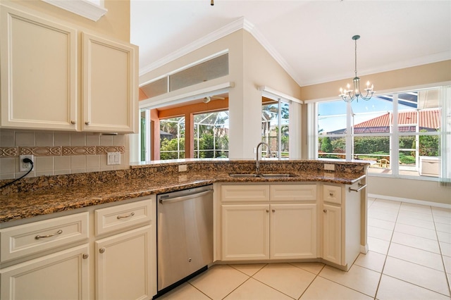 kitchen featuring sink, dark stone countertops, decorative backsplash, stainless steel dishwasher, and light tile patterned floors