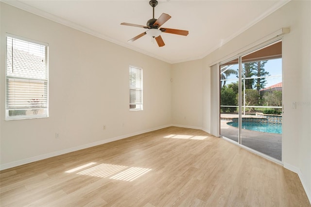 spare room with crown molding, ceiling fan, and light wood-type flooring