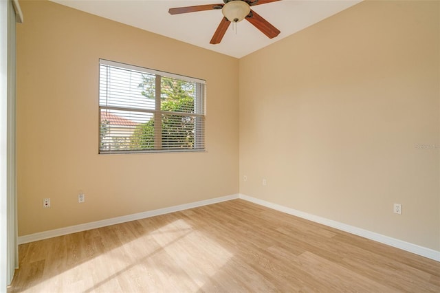 empty room featuring ceiling fan and light hardwood / wood-style floors