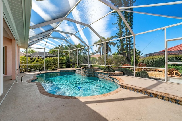 view of swimming pool featuring a lanai and a patio