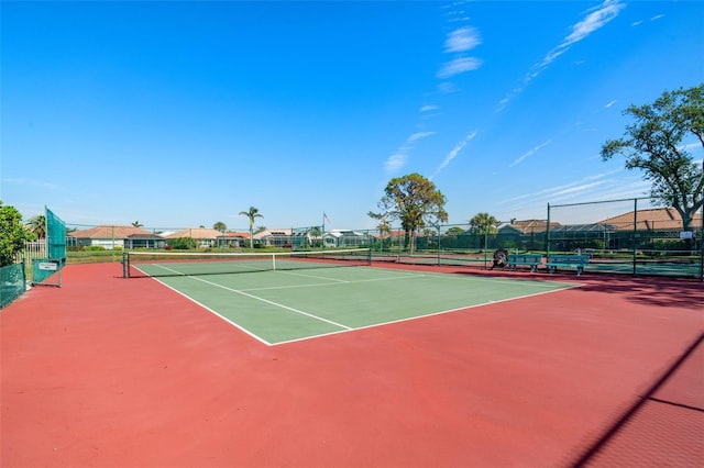 view of tennis court featuring basketball court