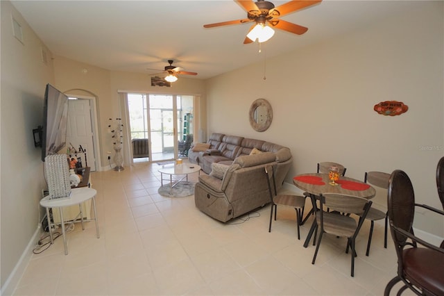 tiled living room featuring ceiling fan