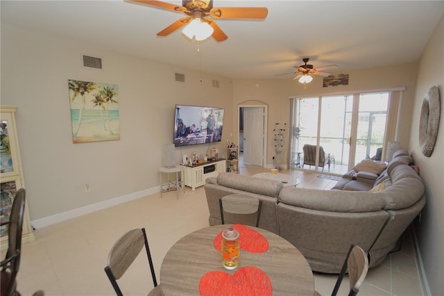 tiled living room with ceiling fan