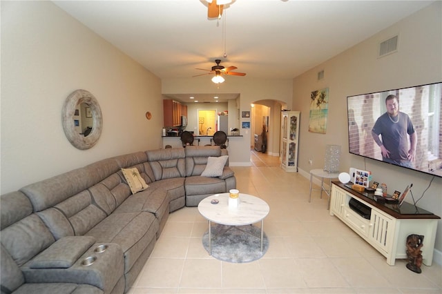 living room featuring ceiling fan and light tile patterned flooring