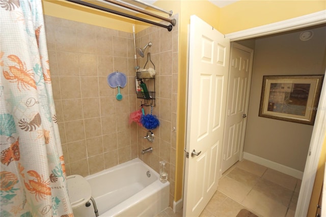 bathroom with tile patterned flooring and shower / bath combo