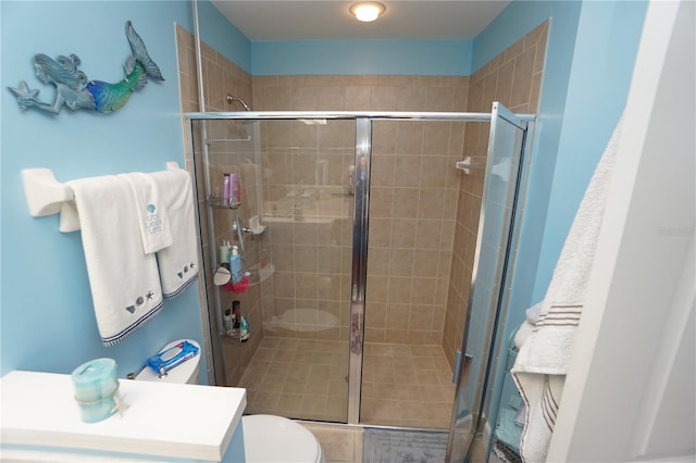 bathroom featuring toilet and walk in shower