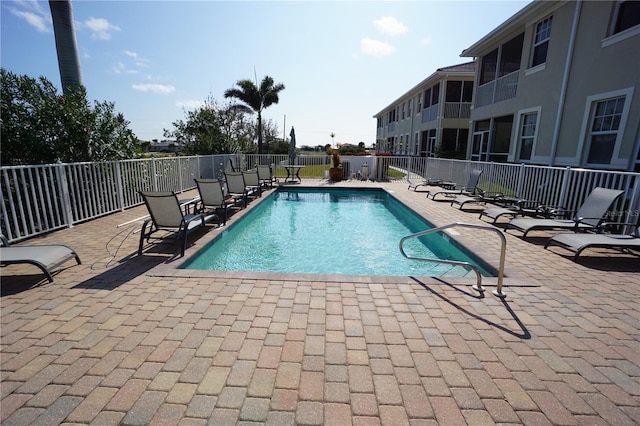 view of swimming pool featuring a patio