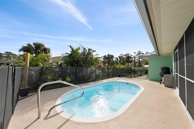 view of swimming pool with a patio