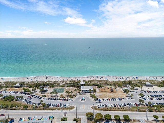 aerial view featuring a water view and a beach view