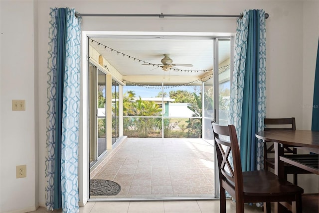 sunroom featuring ceiling fan