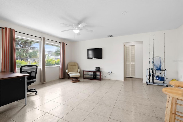 office with ceiling fan and light tile patterned floors