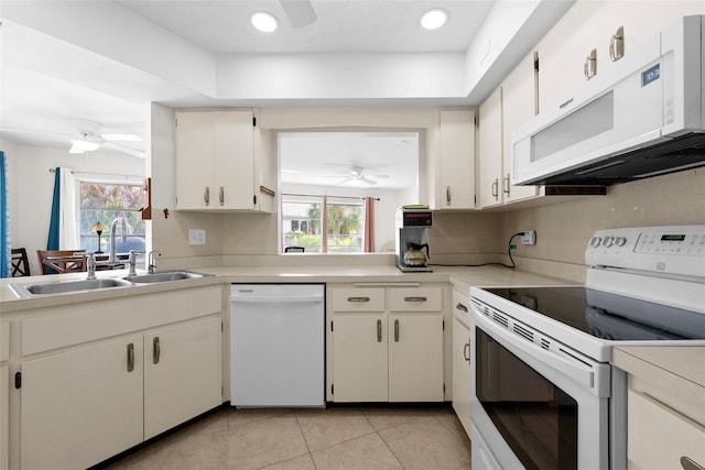 kitchen featuring white cabinetry, sink, ceiling fan, plenty of natural light, and white appliances