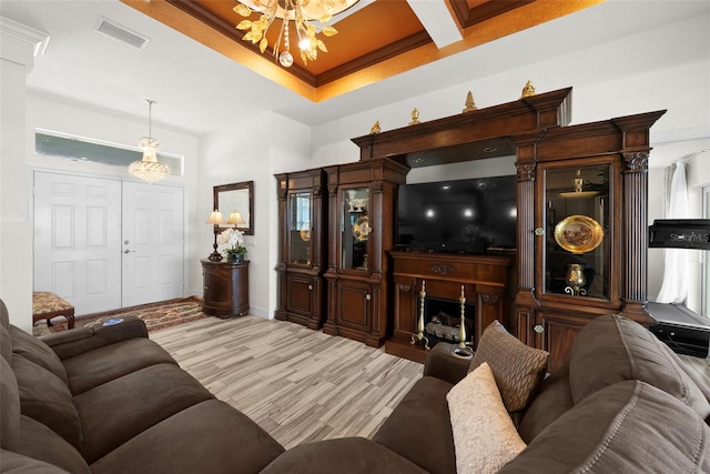 living room with crown molding and light wood-type flooring