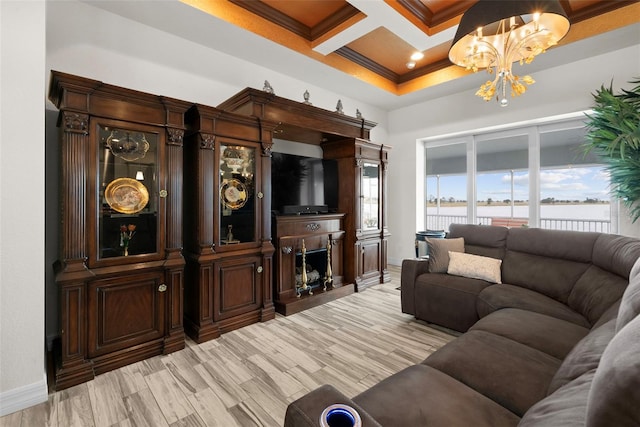 living room featuring an inviting chandelier, beam ceiling, coffered ceiling, a fireplace, and ornamental molding