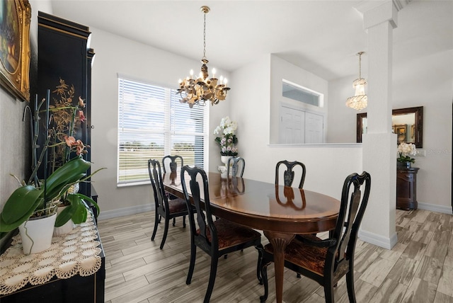 dining room featuring an inviting chandelier, a healthy amount of sunlight, and light wood-type flooring