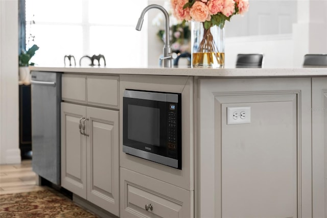 kitchen featuring white cabinetry and appliances with stainless steel finishes