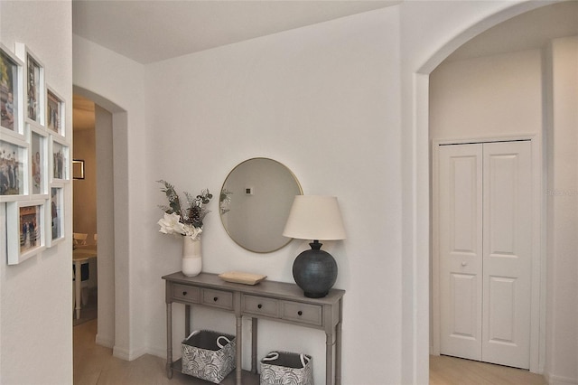 hallway with light hardwood / wood-style floors