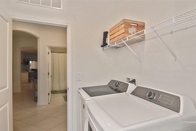 laundry area featuring tile patterned flooring and independent washer and dryer