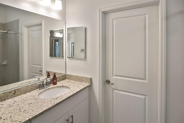 bathroom with vanity and an enclosed shower