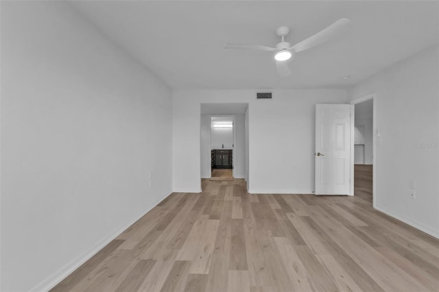 empty room featuring light hardwood / wood-style flooring and ceiling fan