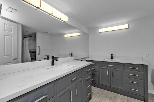 bathroom with vanity and curtained shower