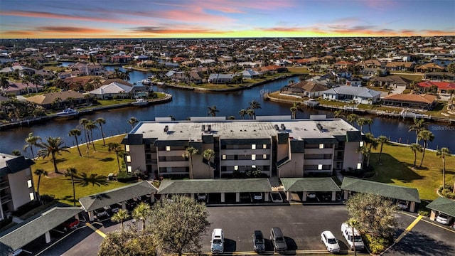 aerial view at dusk with a water view