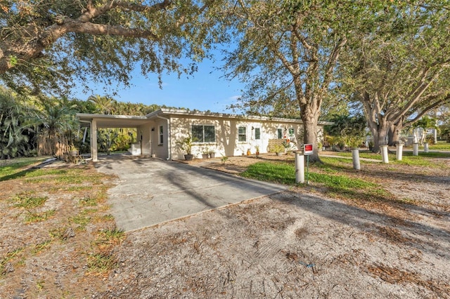 ranch-style house with a carport