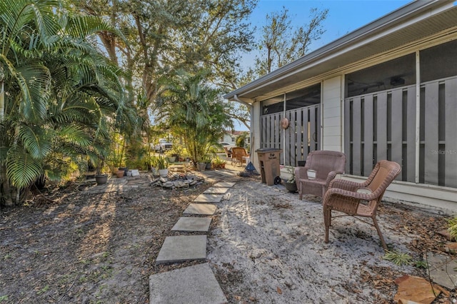 view of patio with a sunroom