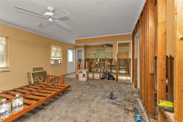 miscellaneous room with a healthy amount of sunlight, cooling unit, ceiling fan, and ornamental molding