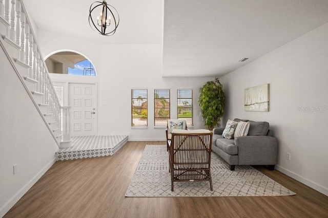 entrance foyer with light hardwood / wood-style floors and a notable chandelier