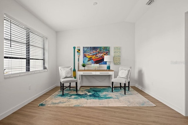 living area with hardwood / wood-style floors