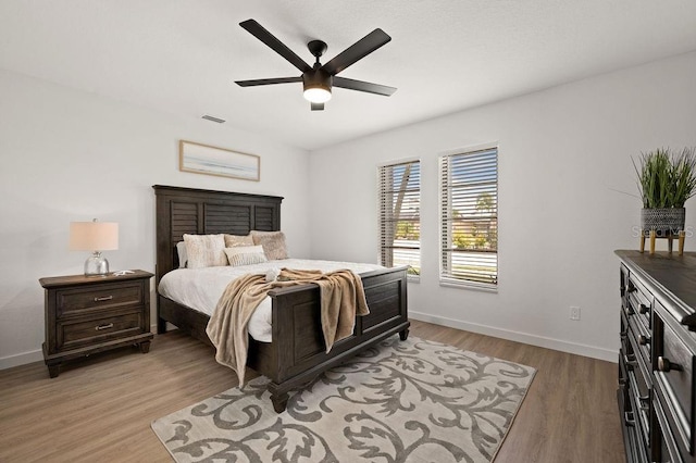 bedroom with light wood-type flooring and ceiling fan