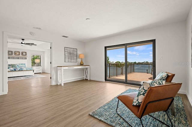 sitting room with hardwood / wood-style floors