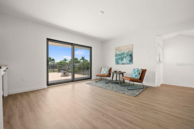 sitting room with light hardwood / wood-style floors