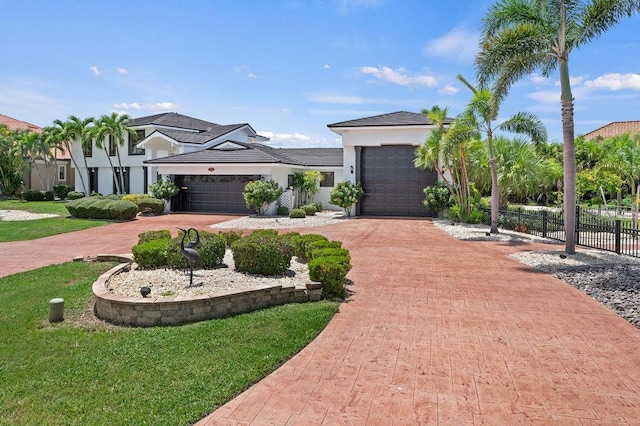 view of front of property with a garage and a front yard